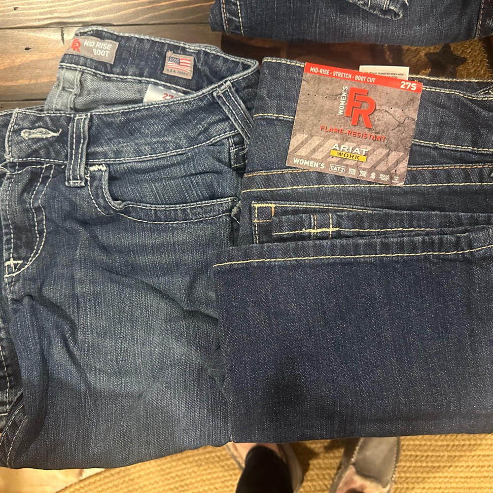Two pair of ariat FR jeans size 27 short. One pair is brand new.